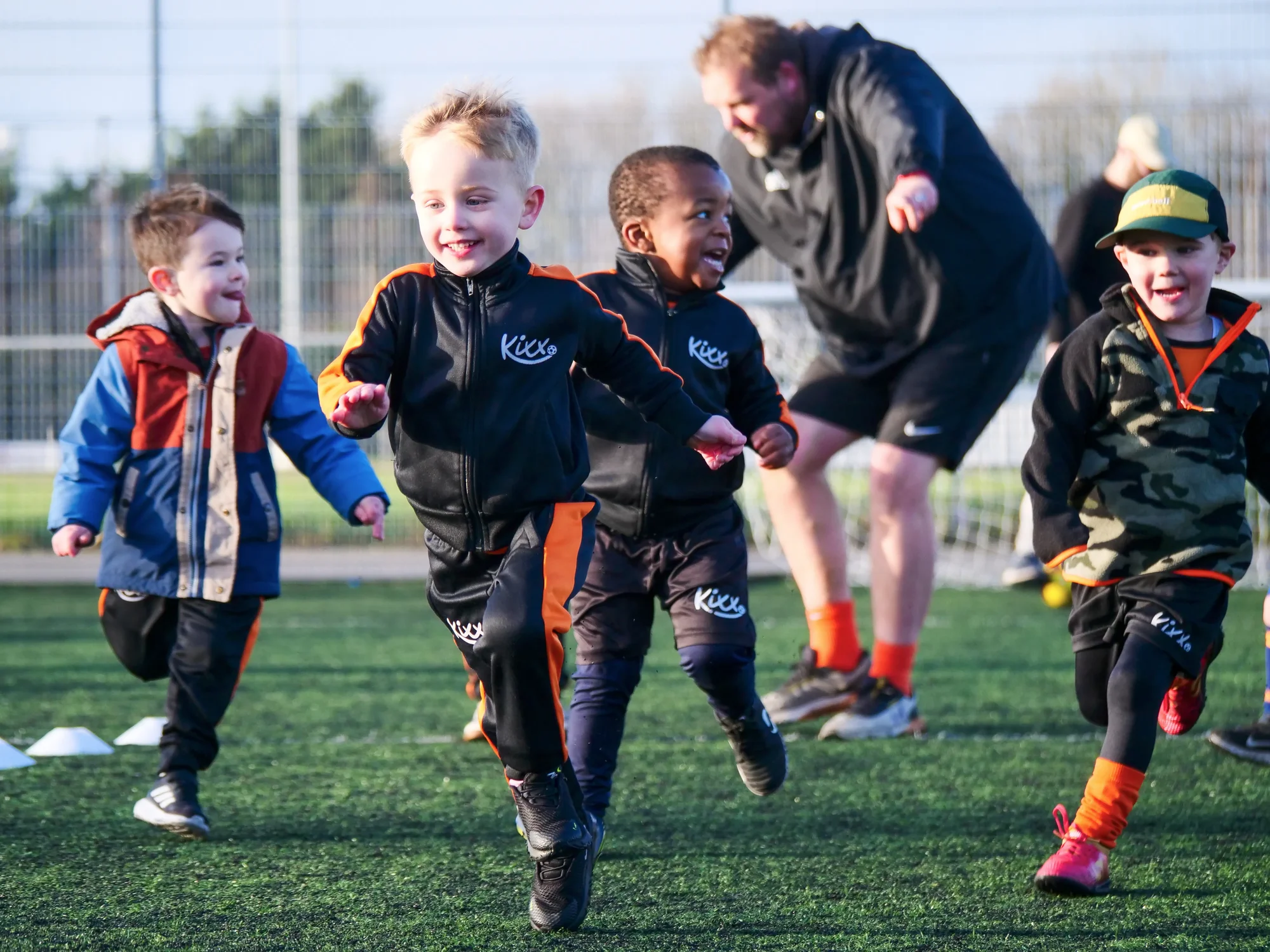 Children playing football at Kixx academy