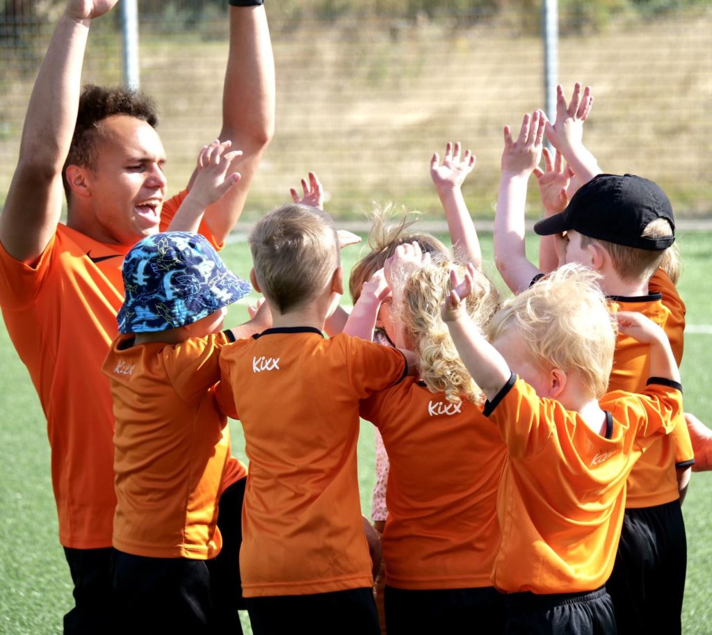 Image of Kixx coach and children for blog about football lessons for 3 year olds