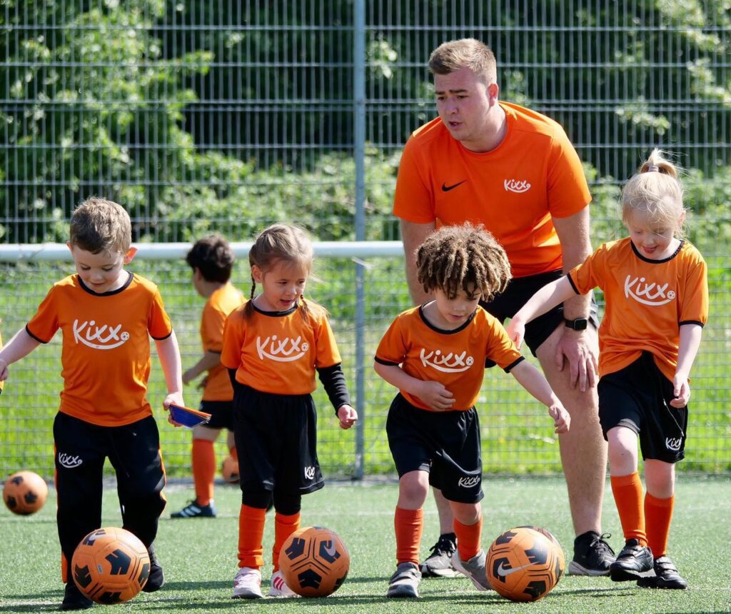 an image of kids in football for under 5s class