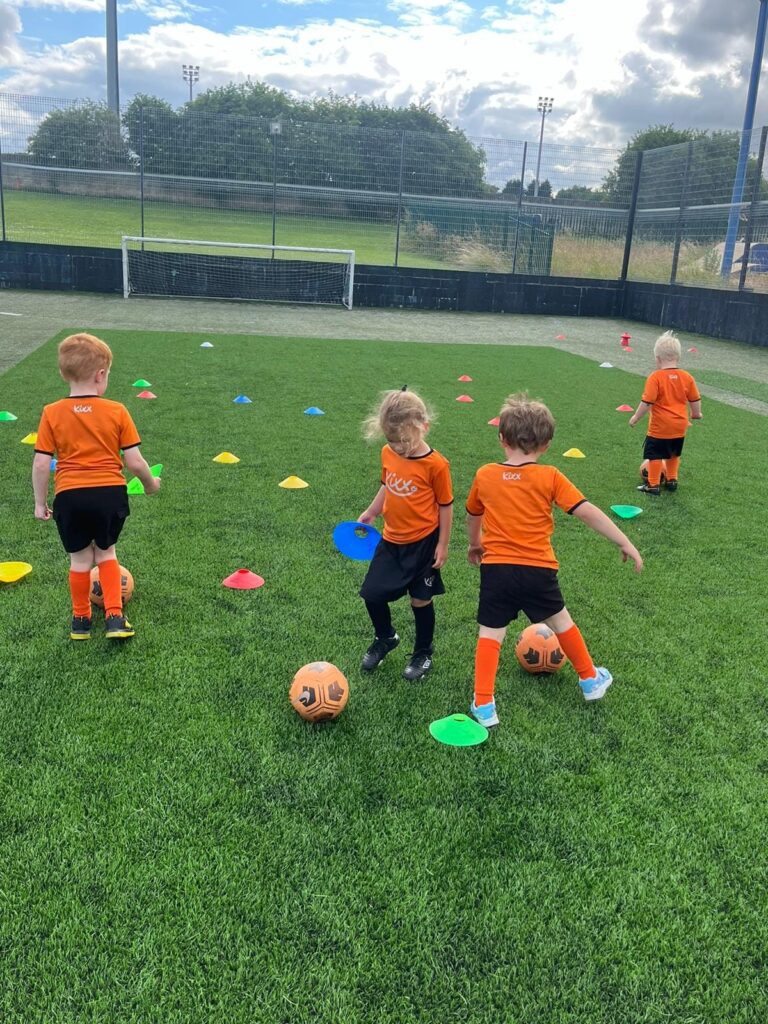 image of group for under 5s playing football for blog 3 Fun Ways to Introduce Football For Under 5s At Home