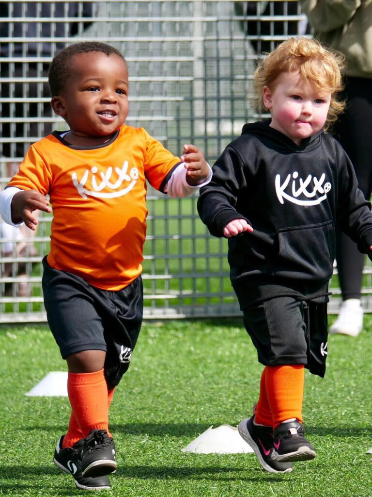 image of two children running for blog 4 Reasons To Choose Our Football Classes 