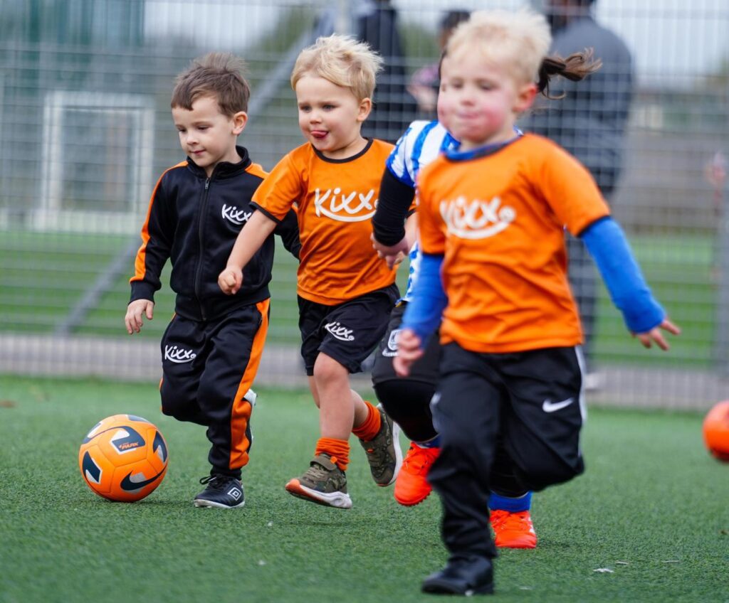 Image of some Kixx players at practice for the blog What Life Lessons Are Children Taught At Our Football Coaching Academy