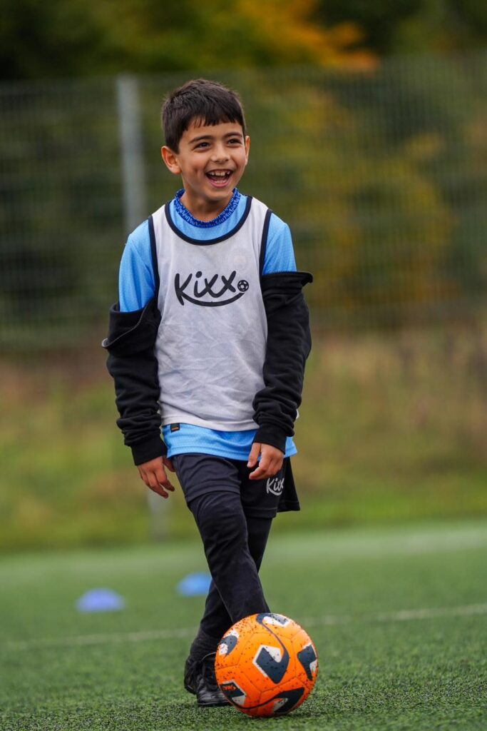 Image of Kixx player in winter uniform for the blog Introducing Your 10 Year Old To Football Classes